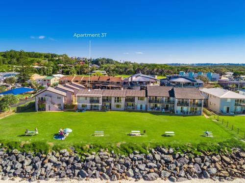 an aerial view of a house with a large yard at Absolute Beachfront Apartments 3T in Lennox Head