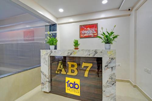 a sign in a room with plants on it at Hotel Abhimanyu Villa in Hyderabad