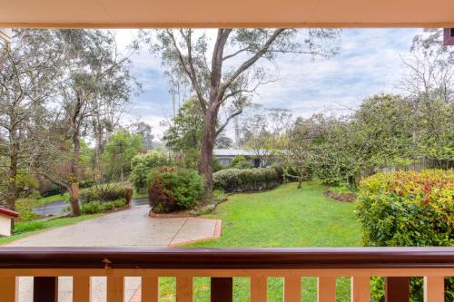 a view from a window of a yard at Stunning Katoomba Home with Lush Garden&Playground in Katoomba