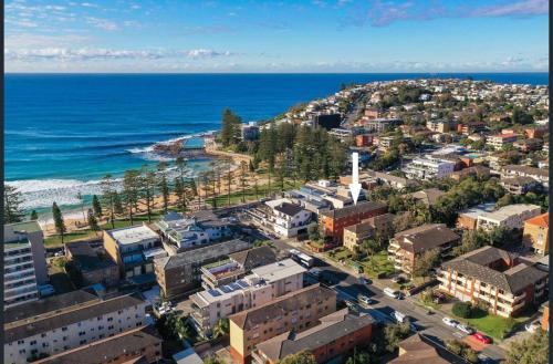 an aerial view of a city and the ocean at MadeComfy Trendy Apartment on Dee Why Beach in Deewhy
