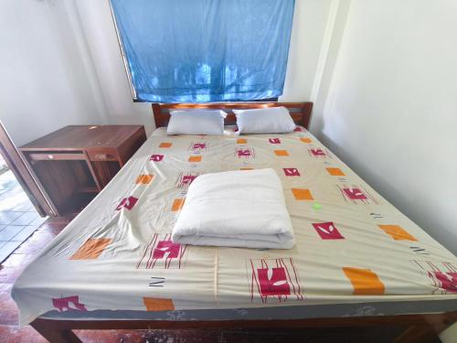 Ένα ή περισσότερα κρεβάτια σε δωμάτιο στο เขาค้อ ภูดาว Resort & Camping