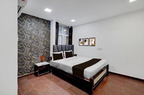 Ένα ή περισσότερα κρεβάτια σε δωμάτιο στο Super Townhouse Oak Q-City Techno Park