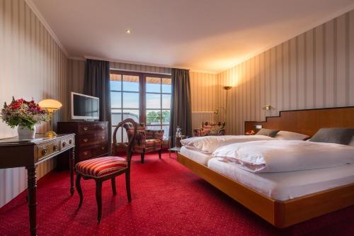 Ένα ή περισσότερα κρεβάτια σε δωμάτιο στο Hotel Restaurant Vinothek LAMM