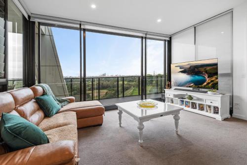 a living room with a couch and a table at A taste of paradise in inner city suburbia in Melbourne
