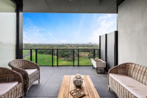 a living room with two chairs and a table at A taste of paradise in inner city suburbia in Melbourne