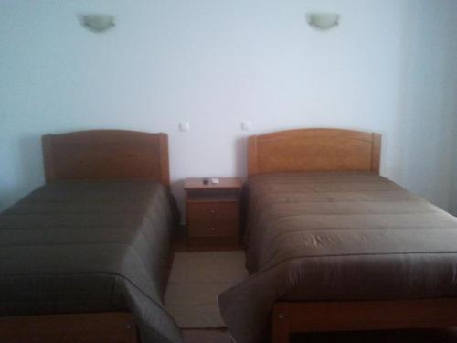 two beds sitting next to each other in a room at A Casa in Portel