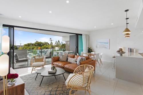 a living room with a couch and a table at Gorgeous 3-Bed Apartment with City Views in Brisbane
