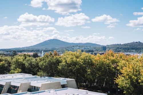 a view from the roof of a building with a mountain in the background at Perfect Located 1-Bed with Great Views & Parking in Kingston