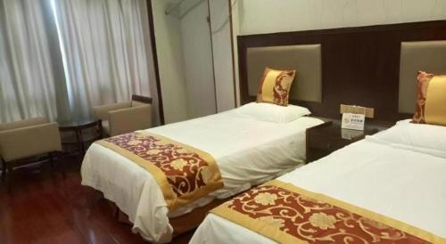 Postel nebo postele na pokoji v ubytování Shell Hotel Wuxi Jiangyin Zhutang Town