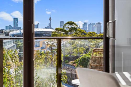 a view of a city skyline from a window at Prime Location 2-Bed Apartment with Parking in Sydney