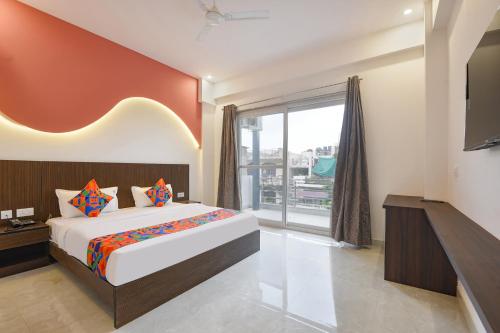 Ένα ή περισσότερα κρεβάτια σε δωμάτιο στο Hotel Royal Residency