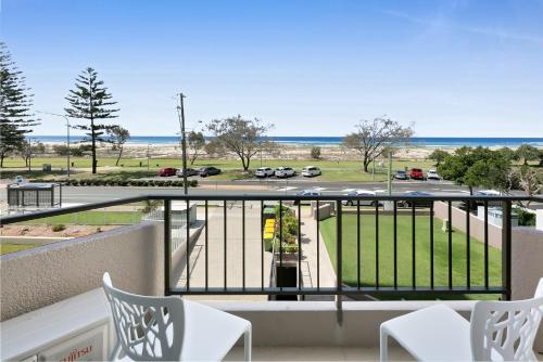 a balcony with a view of a parking lot at Beachfront Studio with Balcony & Stunning Views in Gold Coast