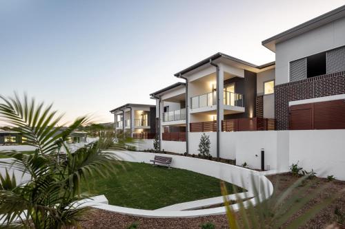 a house with a lawn in front of it at 3-Bed Apartment in Beautiful Kiama with Study Nook in Kiama
