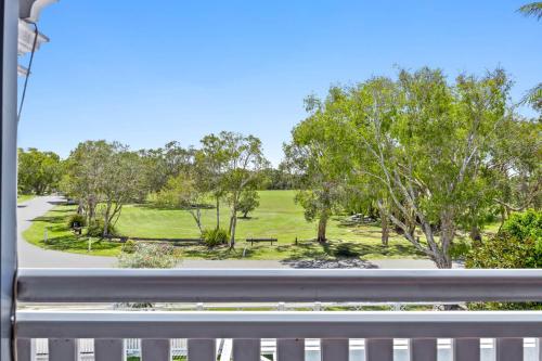 a view of a park from a window at "Xanadu" Charming 2-Bed Retreat by Marcoola Beach in Bli Bli