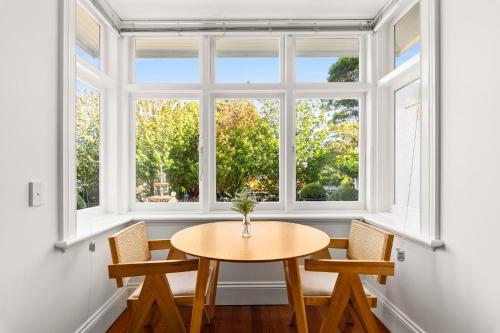 a room with a table and two chairs and a window at Inner-West Studio in a Perfect Location in Sydney