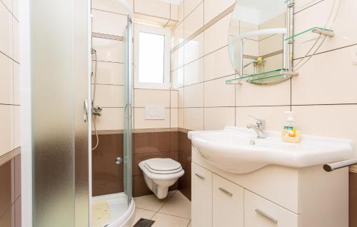 a bathroom with a toilet and a sink and a shower at Appartment Rezika in Šilo