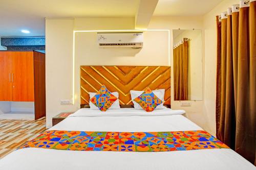 Ένα ή περισσότερα κρεβάτια σε δωμάτιο στο Hotel Nandlala Stays