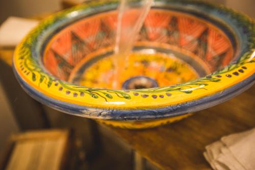 a close up of a bowl of soup on a table at B&B Le Ferule in Manfredonia