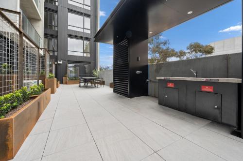 an outdoor patio of a building with a sink at Stylish 2-Bed in Braddon with Alfresco Dining in Canberra