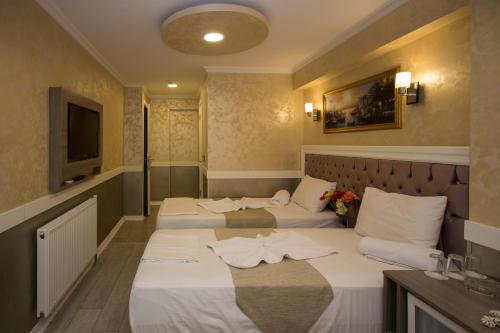 Katil atau katil-katil dalam bilik di Hotel Bestur