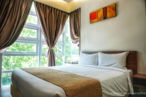 Postel nebo postele na pokoji v ubytování Nex Hotel Johor Bahru