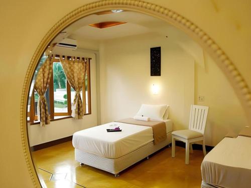 Postel nebo postele na pokoji v ubytování Baansuan Amphawan Resort