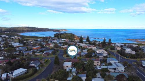 an aerial view of a small town next to the ocean at 4-Bed Beach House with Garden & Alfresco Dining in Tomakin