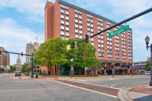 an intersection with a street sign and a building at DoubleTree by Hilton Lansing in Lansing