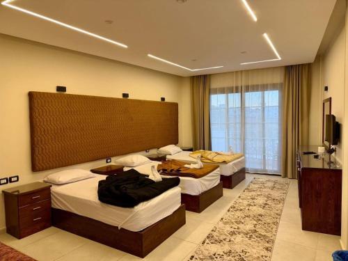 En eller flere senge i et værelse på Marvista Resort Dahab