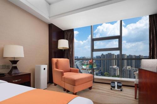 Postel nebo postele na pokoji v ubytování White Swan Hotel ChangSha