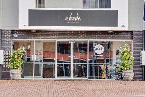 a store front with a bike inside of it at Lakeside 1-Bed with AC, Parking & Balcony in Tuggeranong