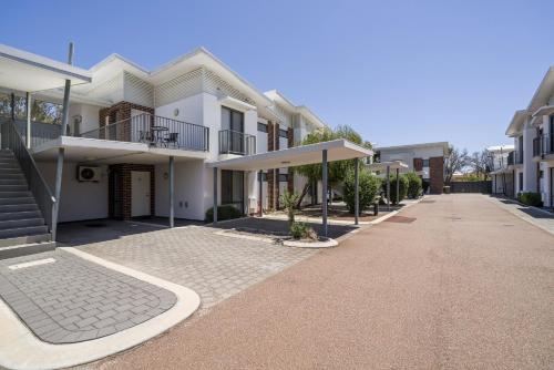 an empty street in a city with houses at Sunny 2-Bed in Quiet Location with Balcony in Perth