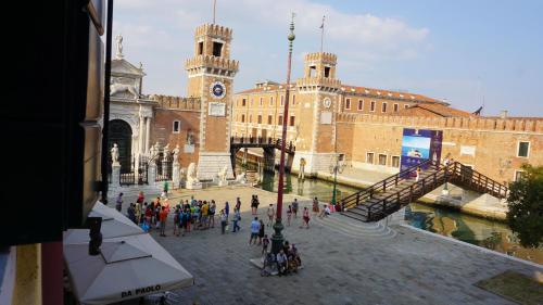 a group of people walking in front of a building at Ca Arsenale in Venice