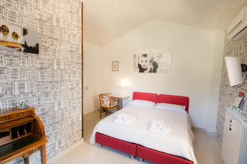 Katil atau katil-katil dalam bilik di La Magnolia B&B