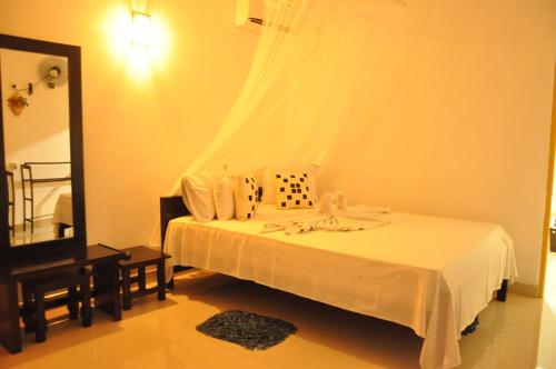 Letto o letti in una camera di Sigiri Rock Side Home Stay