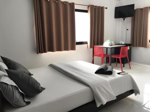 Postel nebo postele na pokoji v ubytování The Color Express Hotel