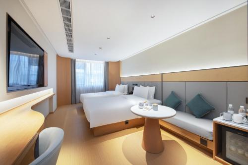 Postel nebo postele na pokoji v ubytování JI Hotel Shenzhen Guanlan Huawei Jiulongshan