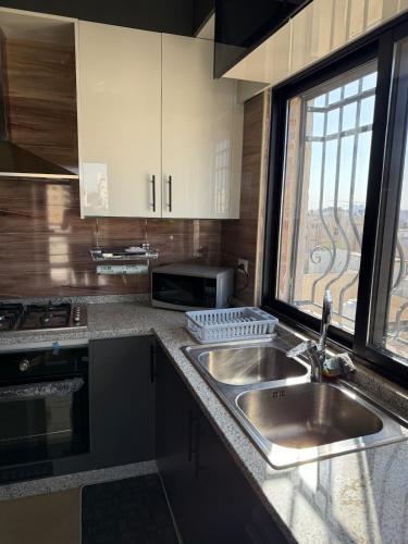 Kuchyň nebo kuchyňský kout v ubytování Sports city 2bd room