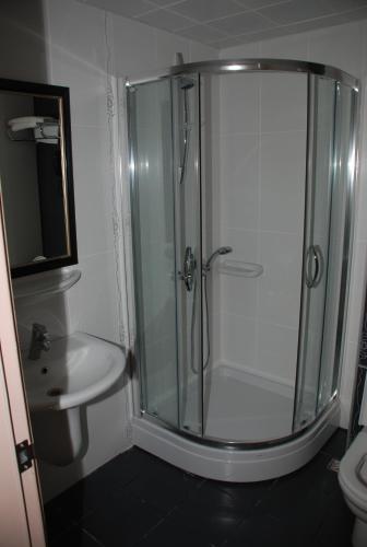 a bathroom with a shower and a sink at Candan Apart in Marmaris