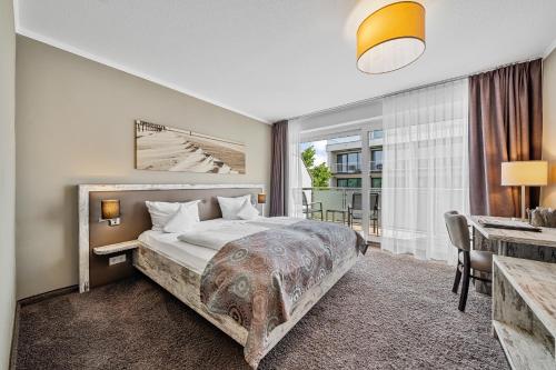 Ένα ή περισσότερα κρεβάτια σε δωμάτιο στο Hotel Strand No.1