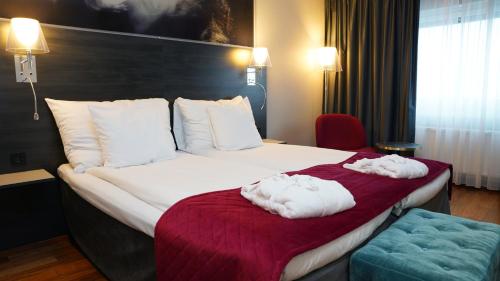 Ένα ή περισσότερα κρεβάτια σε δωμάτιο στο Quality Hotel Sundsvall