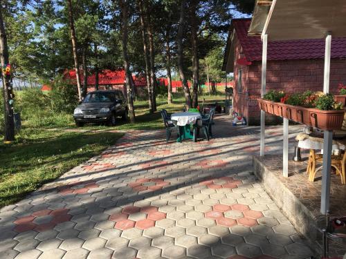a patio with a table and chairs in a yard at Lavanda City 3-1 in Sevan