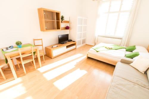 a living room with a couch and a table at Apartment Favoritenstraße in Vienna