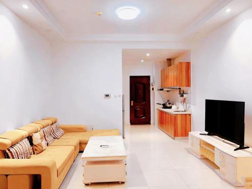 TV a/nebo společenská místnost v ubytování 晨曦公寓酒店