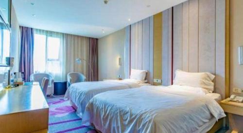 Postel nebo postele na pokoji v ubytování Lavande Hotels Suzhou Railway Station