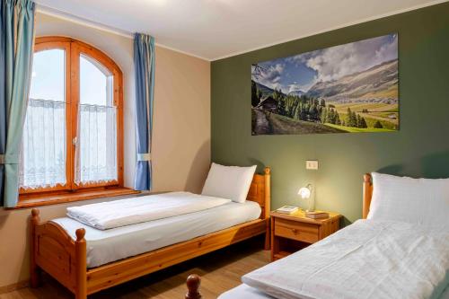 Ένα ή περισσότερα κρεβάτια σε δωμάτιο στο Villa Marilena