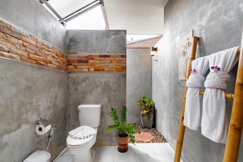 a bathroom with a white toilet and a shower at Baan Piengfah Holiday Home Ao Nang in Ao Nang Beach