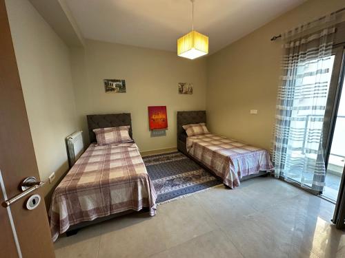 Ένα ή περισσότερα κρεβάτια σε δωμάτιο στο Appartement en résidence, spacieux et lumineux