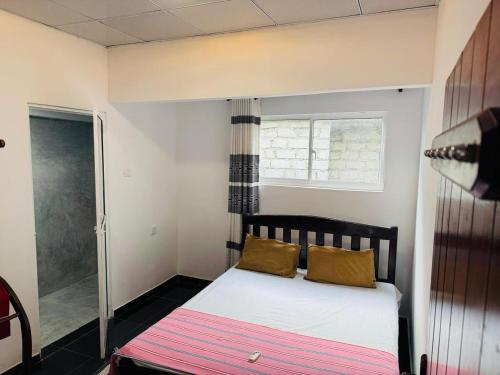 Ένα ή περισσότερα κρεβάτια σε δωμάτιο στο Island Roots