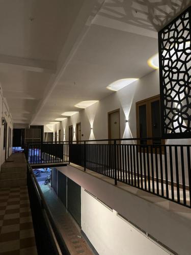 an empty hallway of a building with a pool at Thottunkal Tourist home in Kadavoor